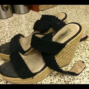 A pair of Steve Madden wedge